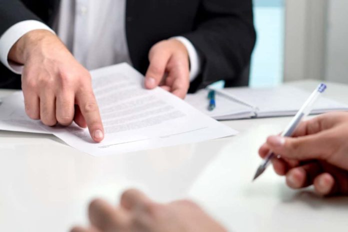 X-Marks-The-Spot-–-Valid-Signatures-For-Wills-In-Texas-1024x682 (1) Attorney showing a client where to sign on their Will.