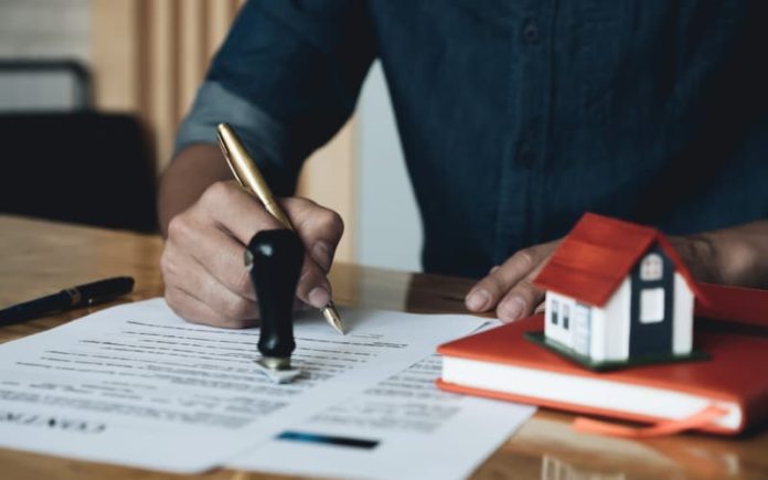 Client reading over Asset Based Lending documents.