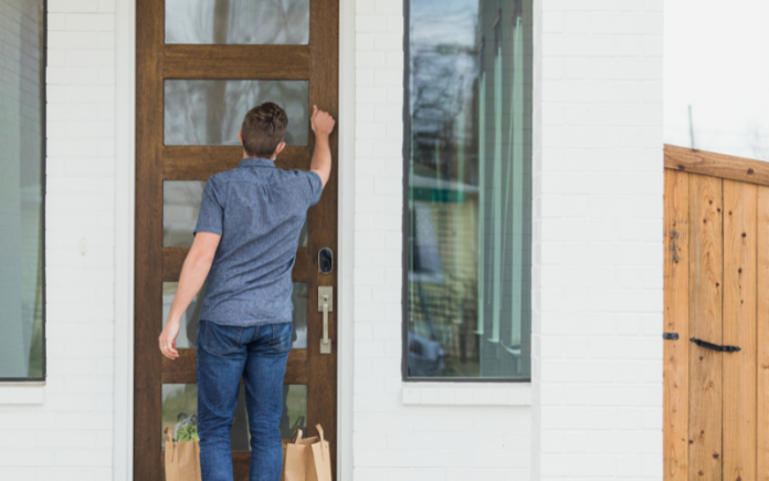 man knocking on someone's front door