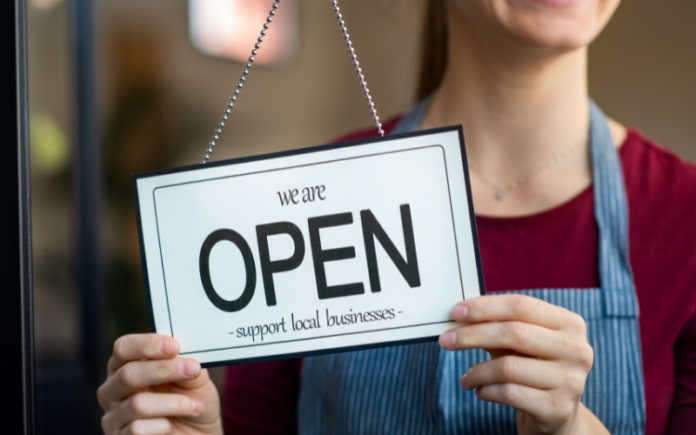 open sign in the window of a business