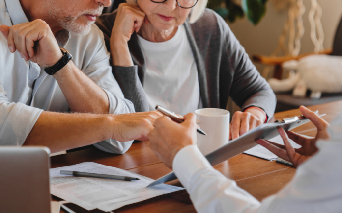 Actual and Constructive Notice Confuses the Best elderly couple reviewing paperwork at a table