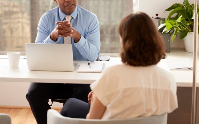 Young adult speaking with an attorney over their estate plan Young adult speaking with an attorney over their estate plan