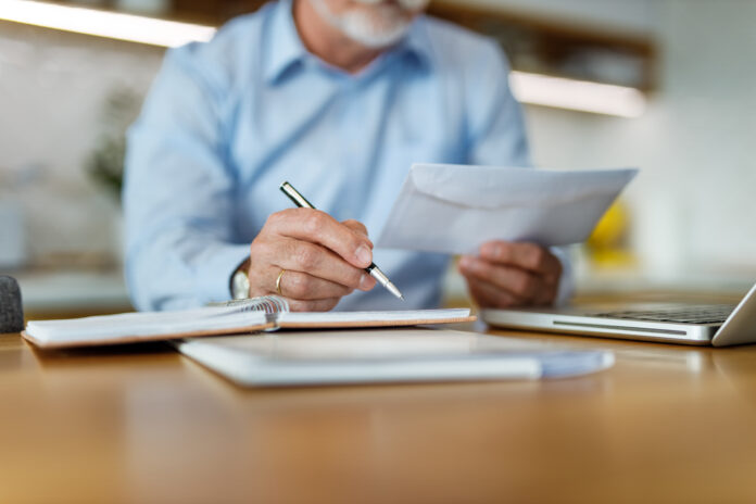 Man holding envelope