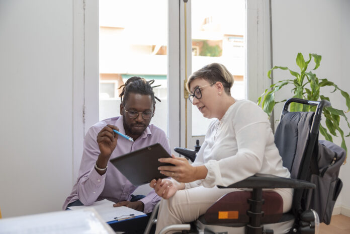 two people working on a tablet
