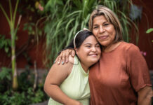 Guardianships for Disabled Adult Children: The Planning Should Start Now Portrait of mother embracing her daughter with special needs outdoors
