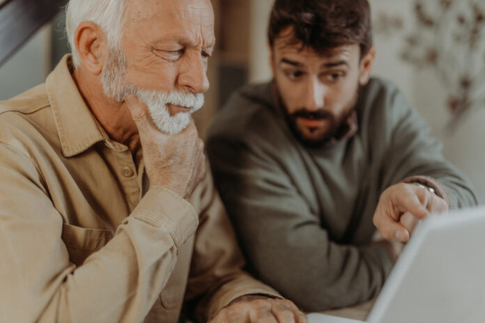 Father and son discussing finances