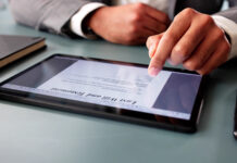 There’s a Form for That: Common Problems With Online Wills Man signs digital last will online, ensuring legal documentation recorded.