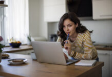 Annuities Are All About Giving — But What Are You Getting in Return? Young woman using a laptop while working from home