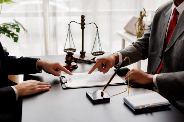 The boss is pointing in the face at the helper who misbehaved in business or legal matters in law firm office. Legal law, advice deal justice and law concept.