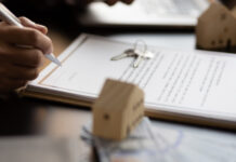Businessman signing a contract for a purchase agreement mortgage and rental housing.