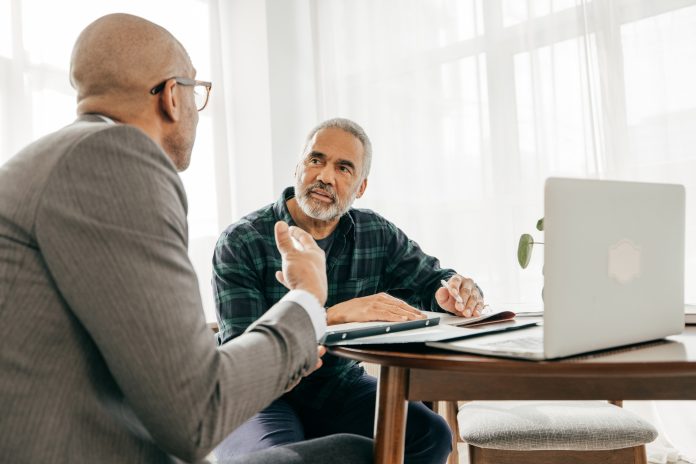 Attorney reviewing a will with a client