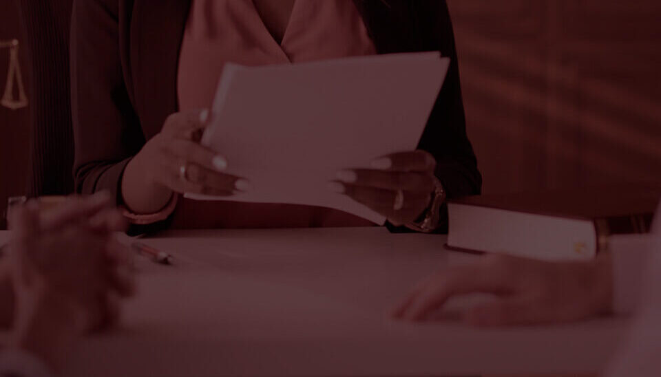 Female lawyer presenting documents to a couple