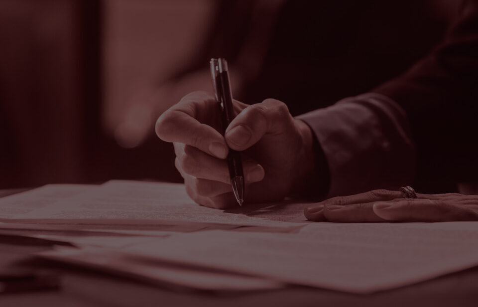 Hand signing a contract